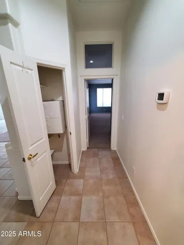a spacious bathroom with a double vanity sink and a mirror