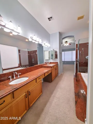 a white toilet sitting next to a white sink