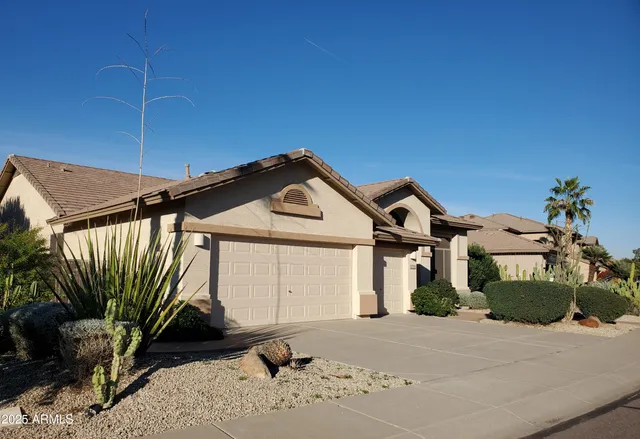 a front view of a house with a wooden fence