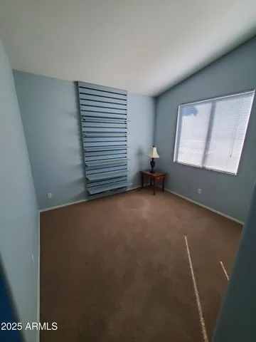 a spacious bathroom with a granite countertop sink a toilet and a mirror