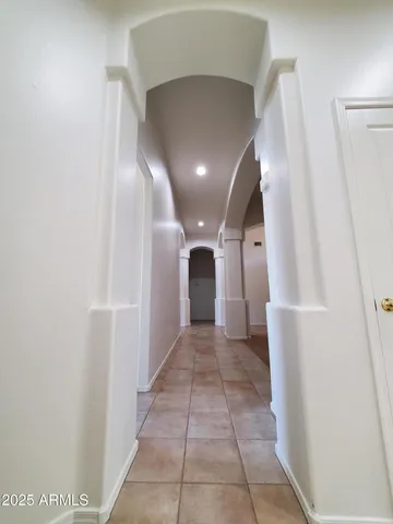 a bed room with a bed and a chair