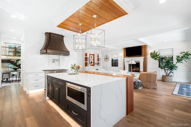 a kitchen with stainless steel appliances a stove a sink and a refrigerator