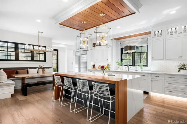 a kitchen with stainless steel appliances granite countertop a stove and a sink