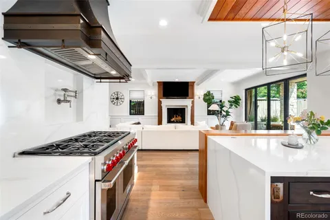 a utility room with lots of clutter and cabinets