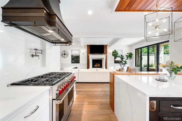a utility room with lots of clutter and cabinets