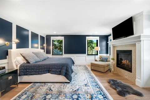 a living room with a couch a window and a fireplace