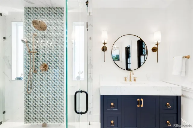 a spacious bathroom with a double vanity sink mirror and bathtub