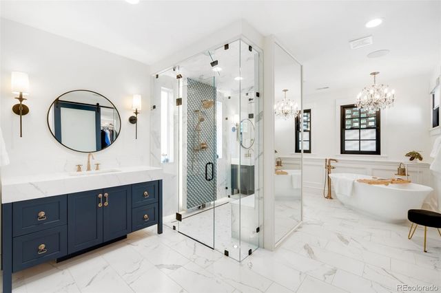 a view of walk in closet with clothes