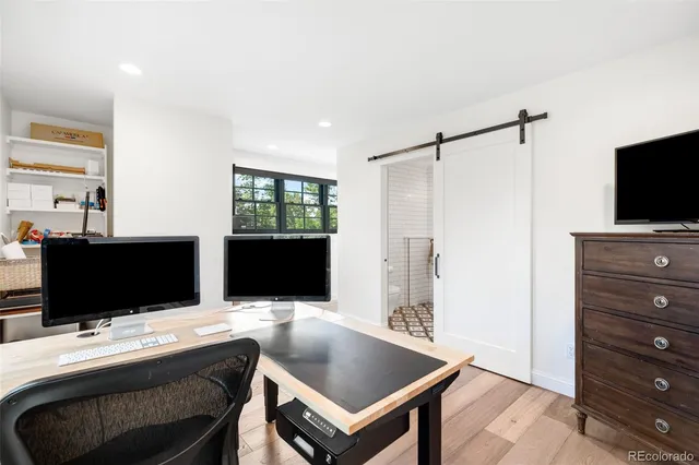 a kitchen with stainless steel appliances a sink a stove and a refrigerator