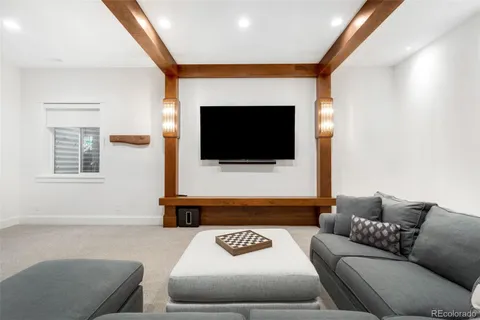 a bathroom with a sink mirror and a shower