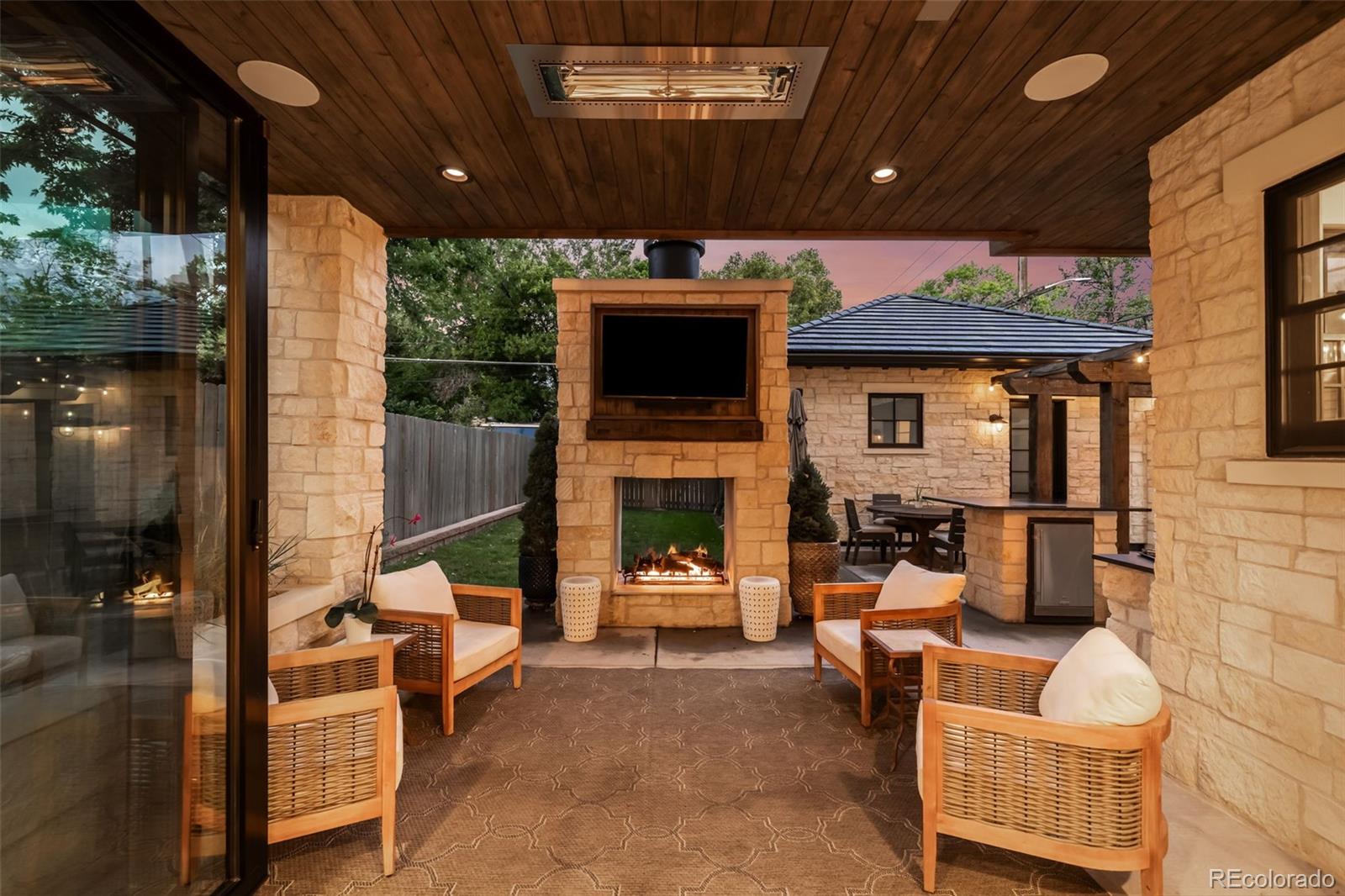 1296 South York Street Denver, CO 80210 - Photo 46 of 49 a living room with furniture and a fireplace