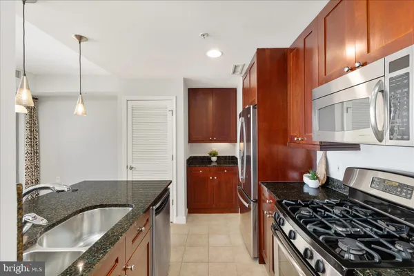 a kitchen with a table and chairs in it
