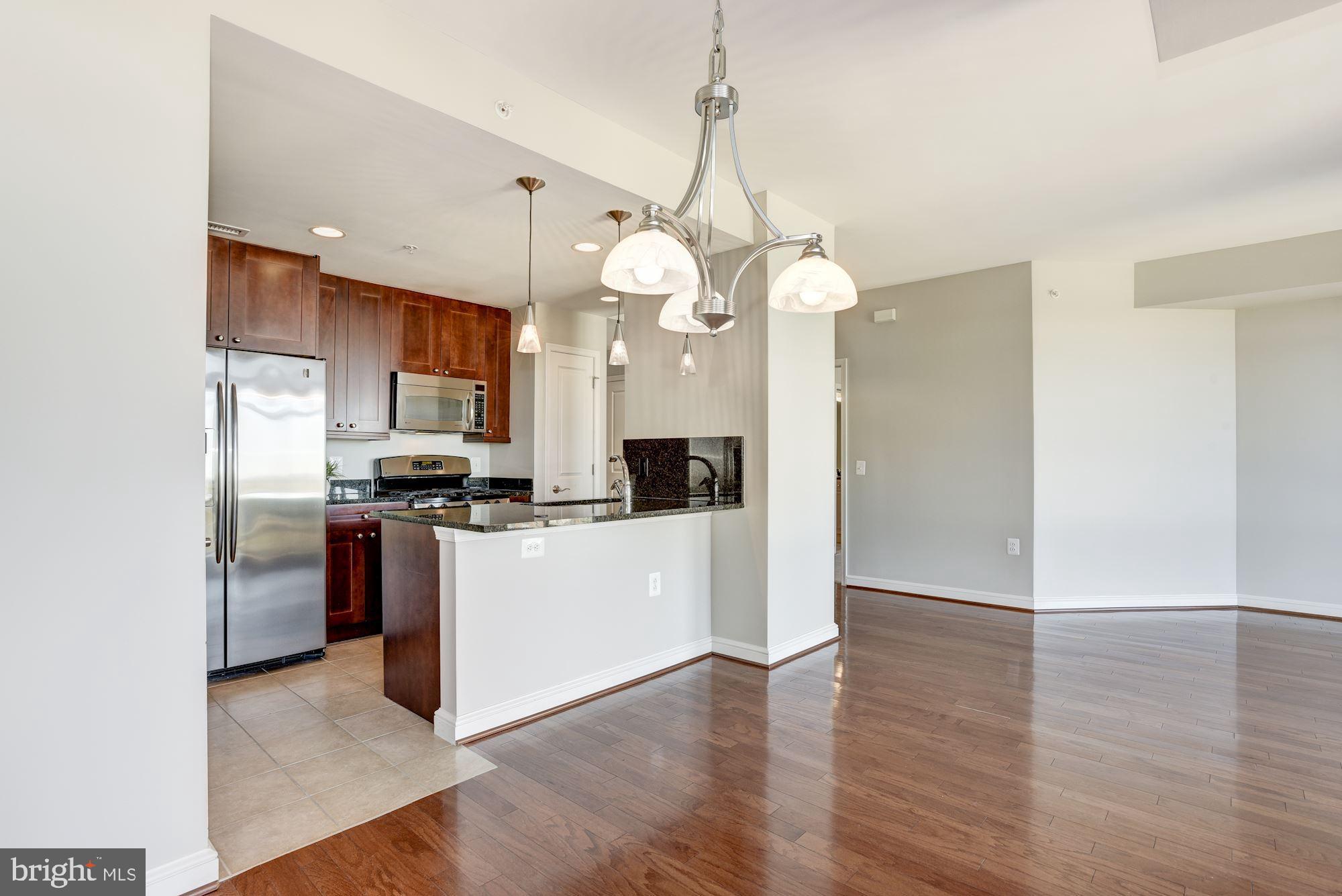 11990 Market Street, Unit 1106 Reston, VA 20190 - Photo 12 of 48 Dining Room + Kitchen | Main Level