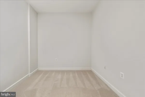 a patio with a table and chairs under an umbrella
