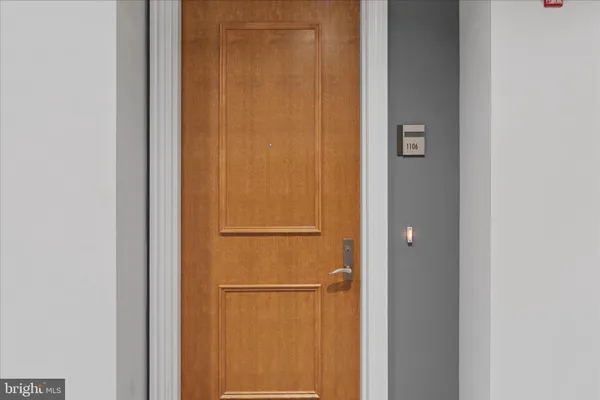 a lobby with furniture and floor to ceiling window