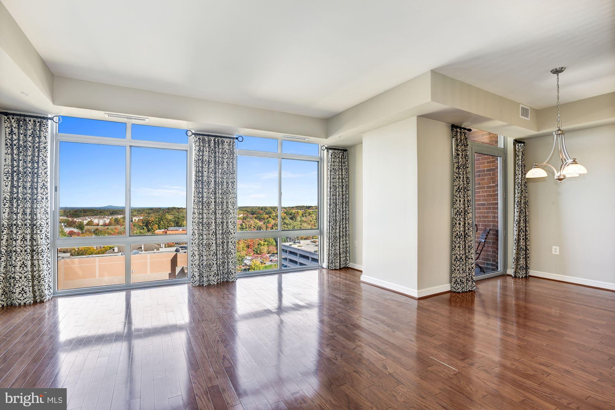11990 Market Street, Unit 1106 Reston, VA 20190 - Photo 7 of 48 Living + Dining Room | Main Level
