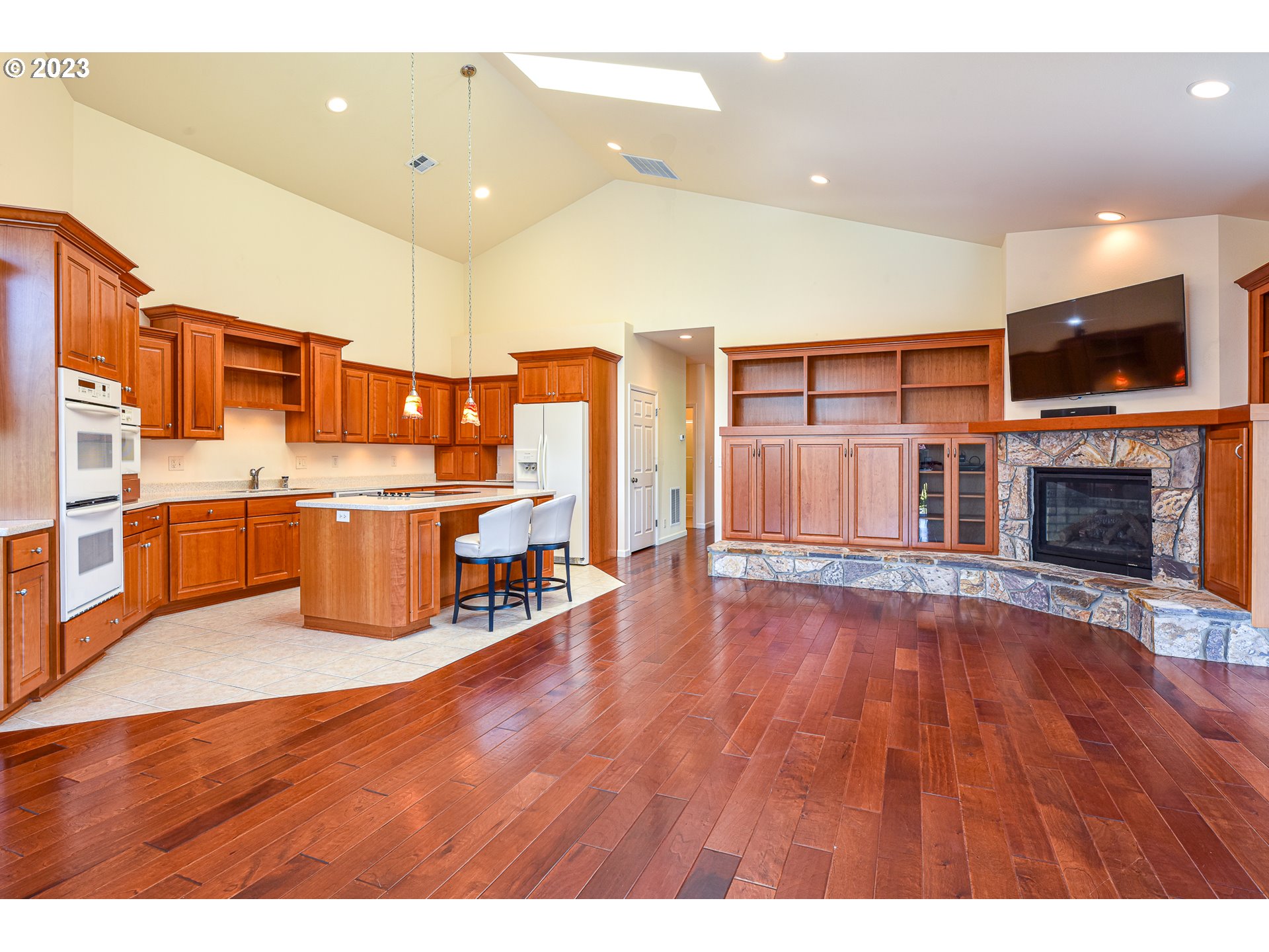 2002 Lake Shore Drive Eugene, OR 97408 - Photo 11 of 37 a view of kitchen with stainless steel appliances wooden floor and living room view