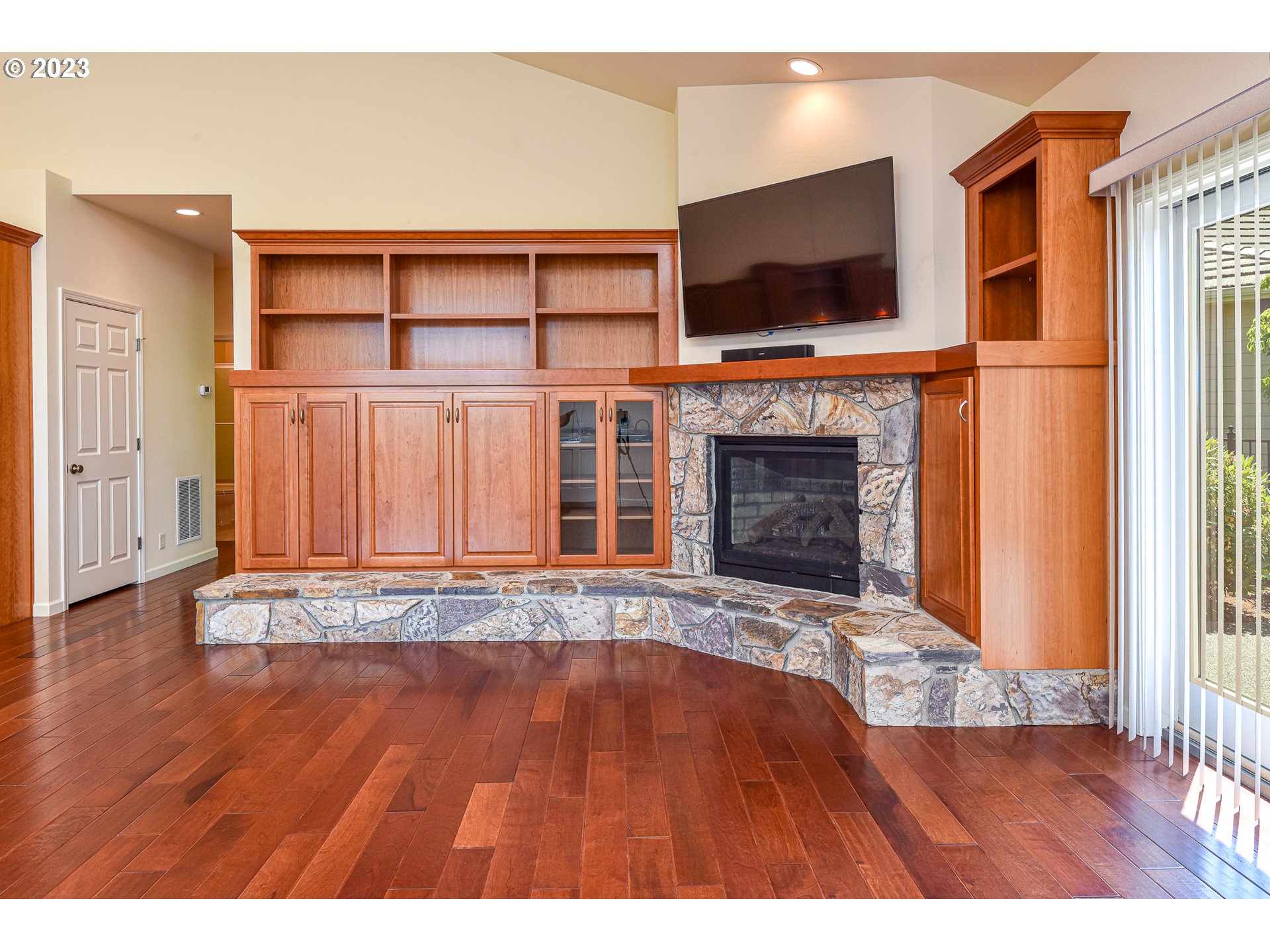 2002 Lake Shore Drive Eugene, OR 97408 - Photo 13 of 37 a view of a livingroom with wooden floor and a fireplace