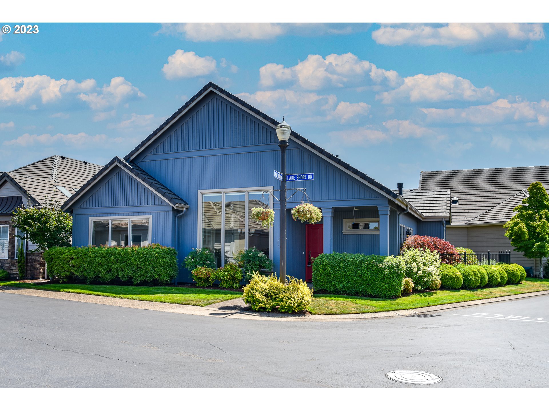 2002 Lake Shore Drive Eugene, OR 97408 - Photo 2 of 37 a front view of a house with a yard and potted plants