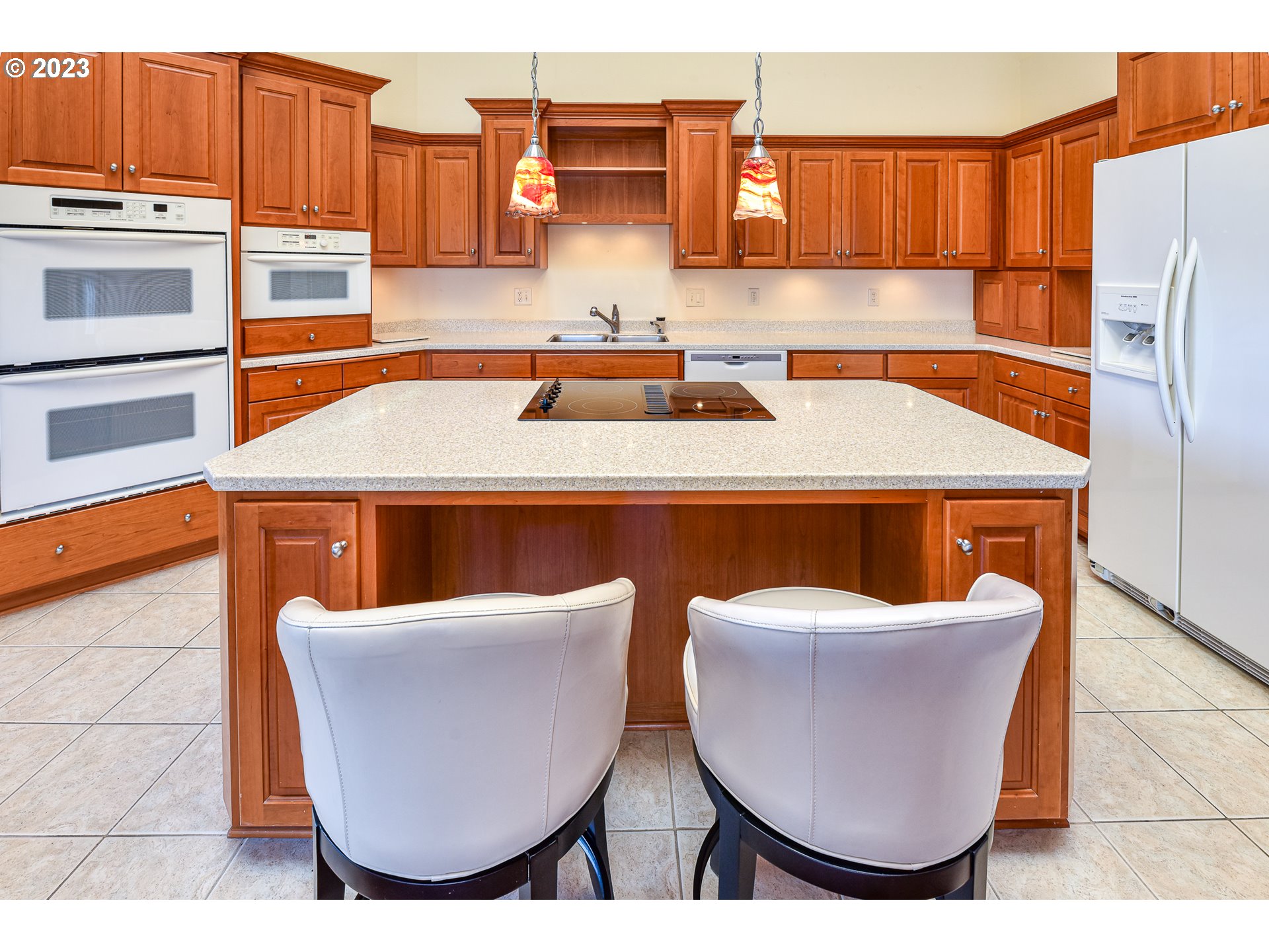 2002 Lake Shore Drive Eugene, OR 97408 - Photo 21 of 37 a kitchen with stainless steel appliances granite countertop a sink and a refrigerator
