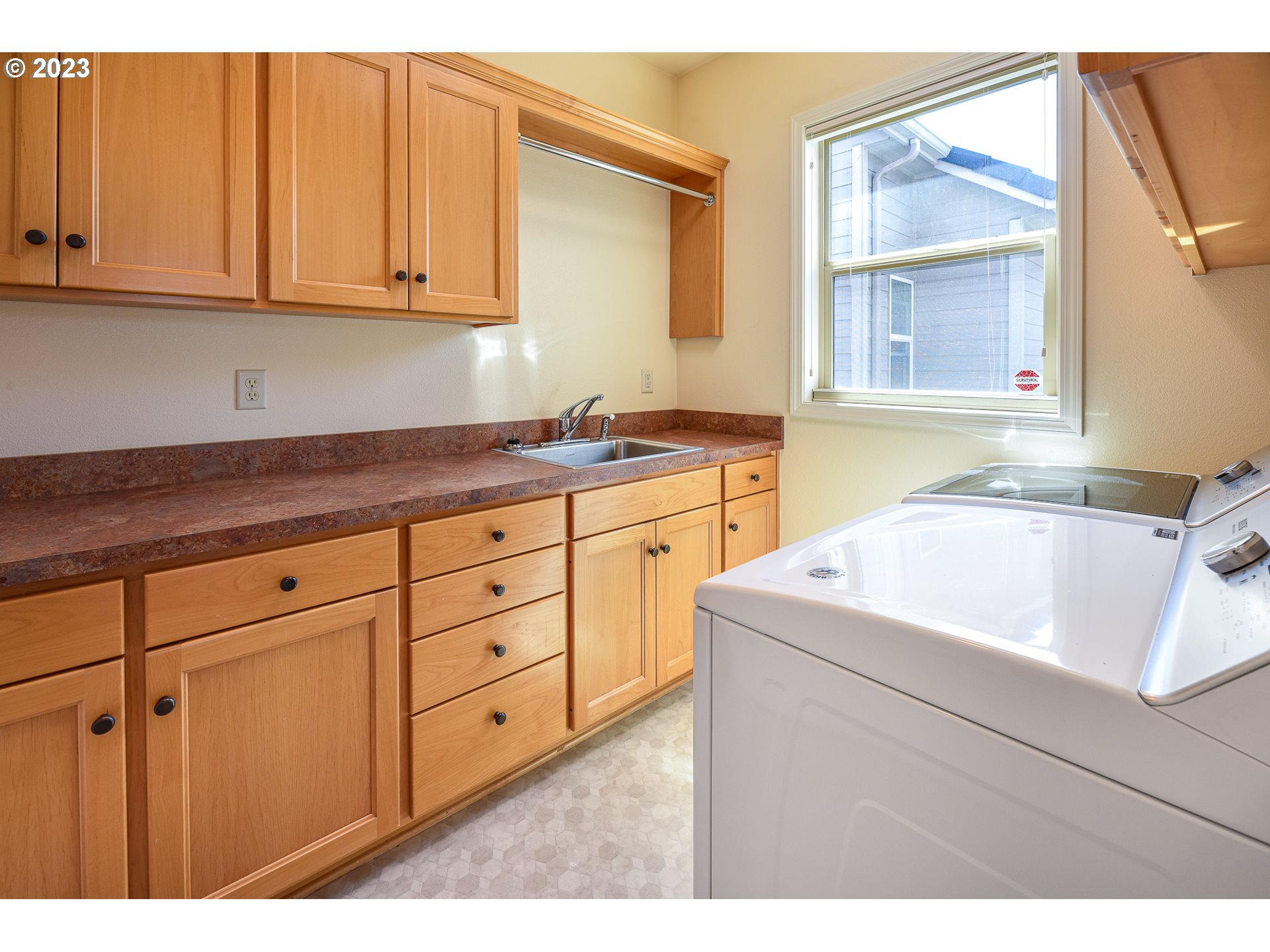 2002 Lake Shore Drive Eugene, OR 97408 - Photo 32 of 37 a kitchen with cabinets appliances a sink and a window