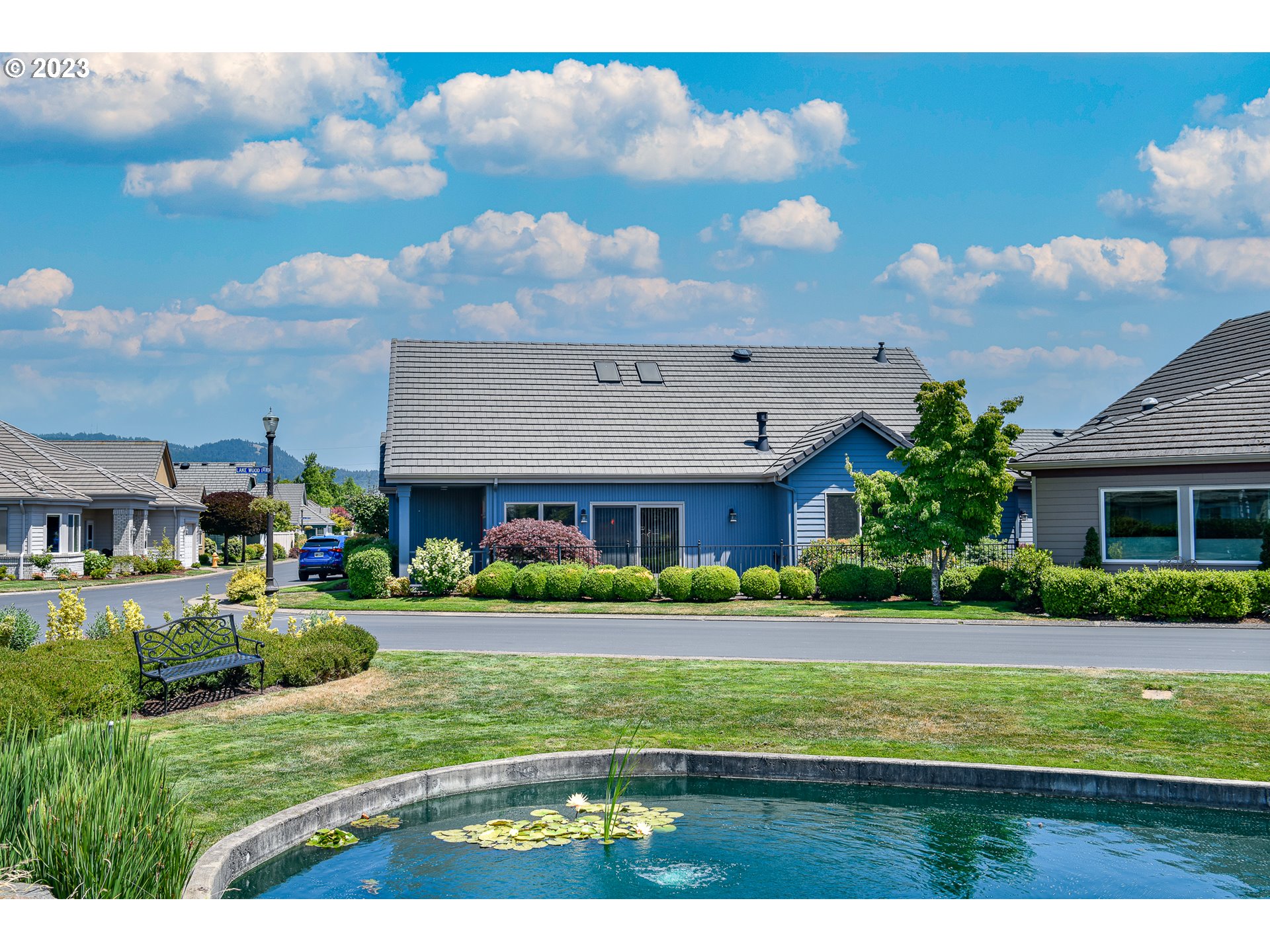 2002 Lake Shore Drive Eugene, OR 97408 - Photo 4 of 37 a view of a big house with a big yard and potted plants