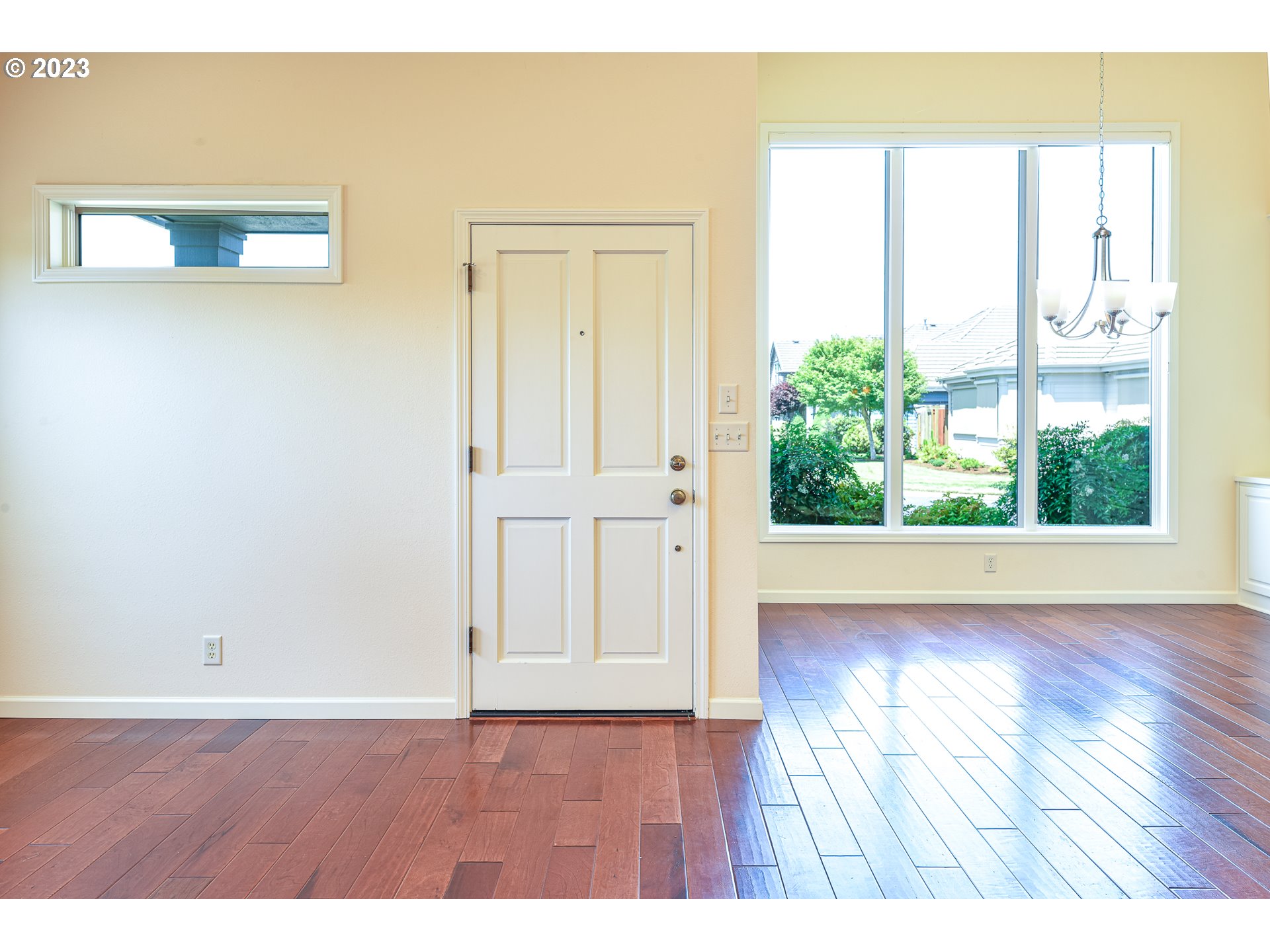 2002 Lake Shore Drive Eugene, OR 97408 - Photo 10 of 37 an empty room with wooden floor and windows