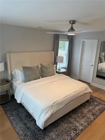 a bedroom with bed and window