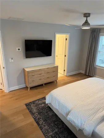 a bedroom with a bed and window