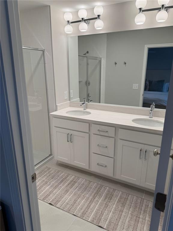 1925 Appian Alley Kennesaw, GA 30144 - Photo 16 of 27 a spacious bathroom with a double vanity sink and mirror