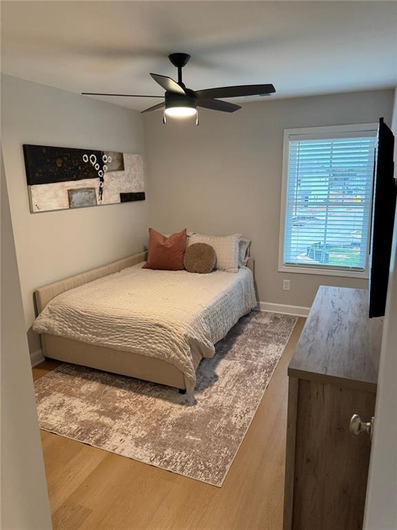 1925 Appian Alley Kennesaw, GA 30144 - Photo 19 of 27 a bedroom with a bed and a large window