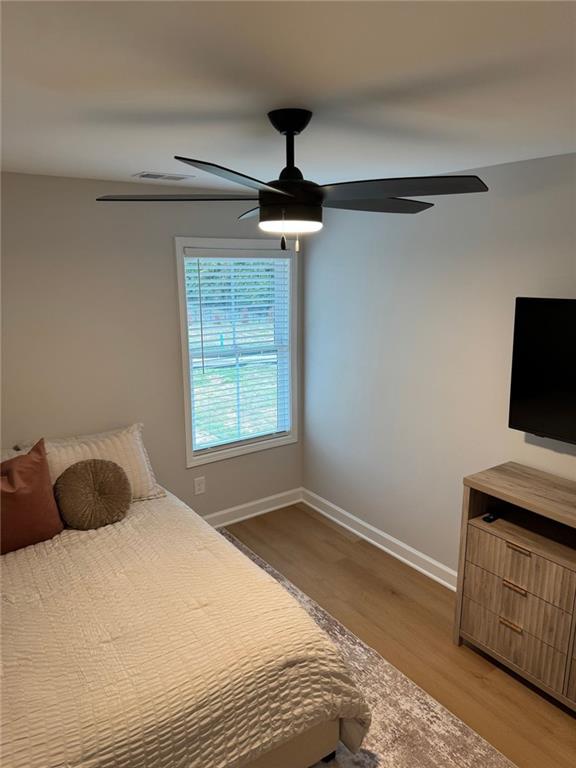 1925 Appian Alley Kennesaw, GA 30144 - Photo 20 of 27 a bedroom with a bed and a flat tv screen on a dresser