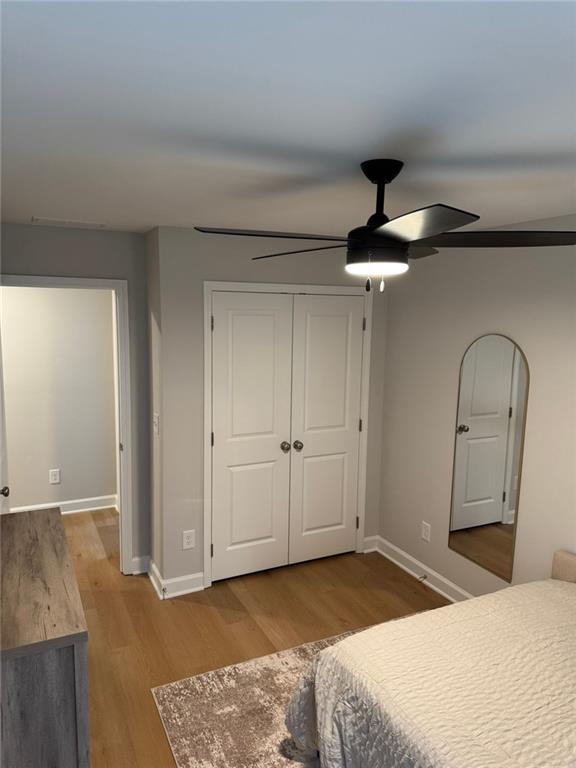 1925 Appian Alley Kennesaw, GA 30144 - Photo 21 of 27 a bedroom with a bed and a chandelier