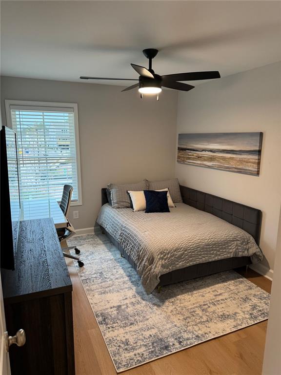 1925 Appian Alley Kennesaw, GA 30144 - Photo 23 of 27 a bedroom with a bed and wooden floor