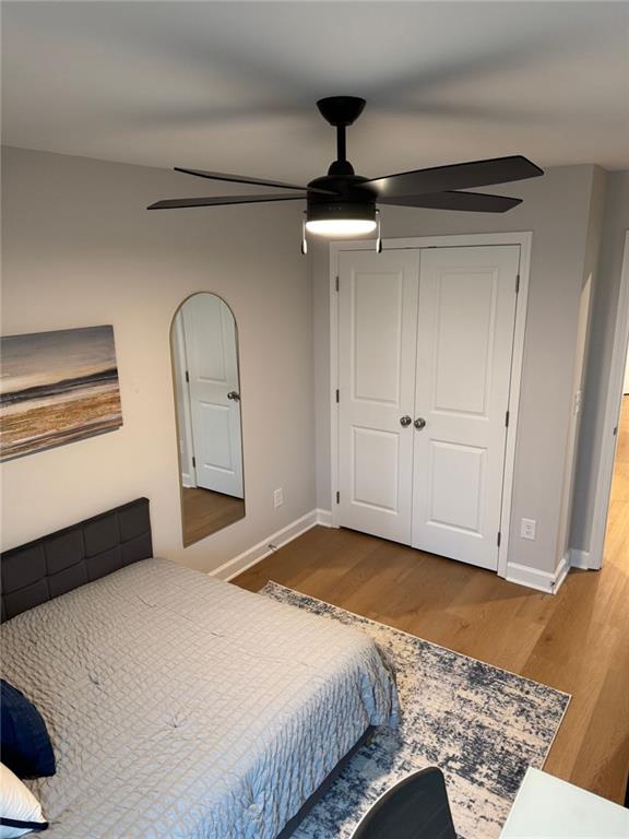 1925 Appian Alley Kennesaw, GA 30144 - Photo 25 of 27 a bedroom with a large bed and a chandelier