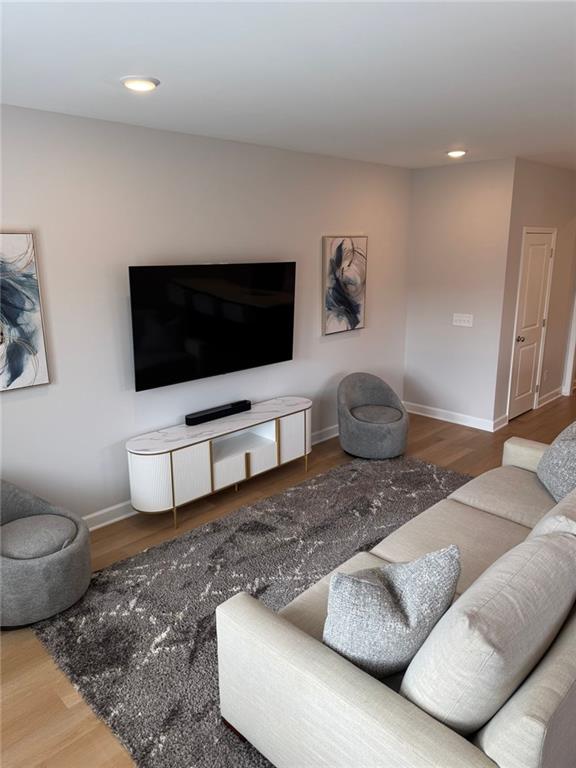1925 Appian Alley Kennesaw, GA 30144 - Photo 8 of 27 a living room with furniture and a flat screen tv