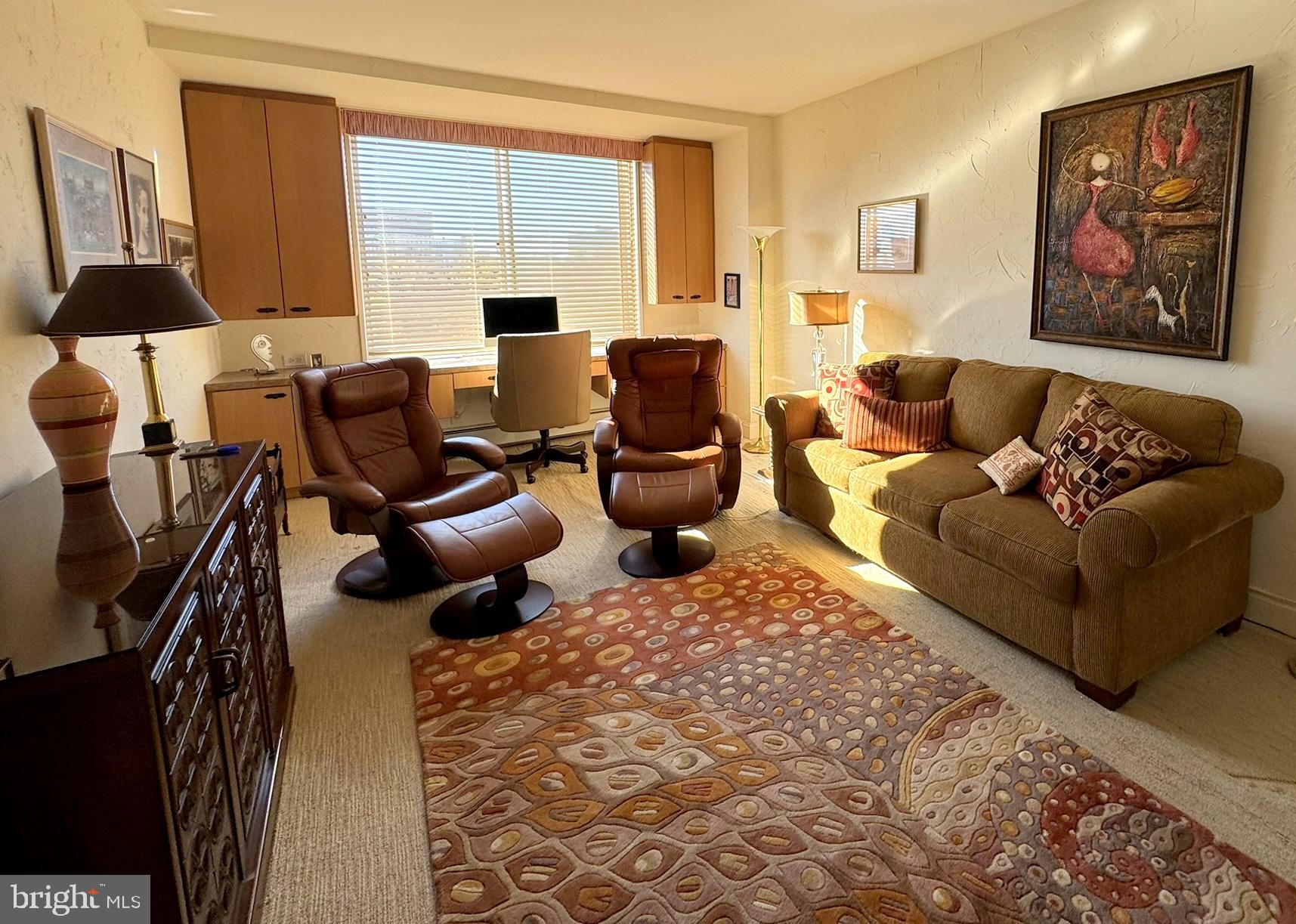 191 Presidential Boulevard, Unit R816 Bala Cynwyd, PA 19004 - Photo 37 of 42 a living room with furniture or couch and a large window