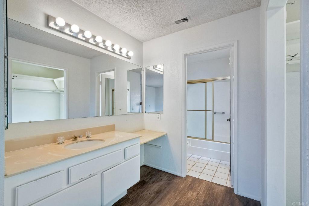 3579 Twilight Lane Oceanside, CA 92056 - Photo 20 of 30 a spacious bathroom with a granite countertop sink mirror and vanity