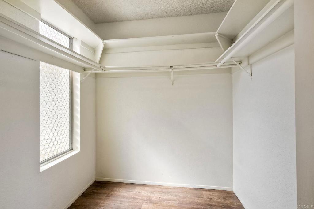 3579 Twilight Lane Oceanside, CA 92056 - Photo 22 of 30 a view of an empty room with wooden floor and a window