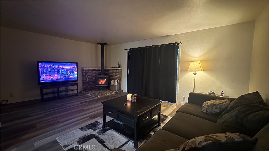 25248 Robinson Road Willits, CA 95490 - Photo 14 of 19 a living room with furniture and a flat screen tv