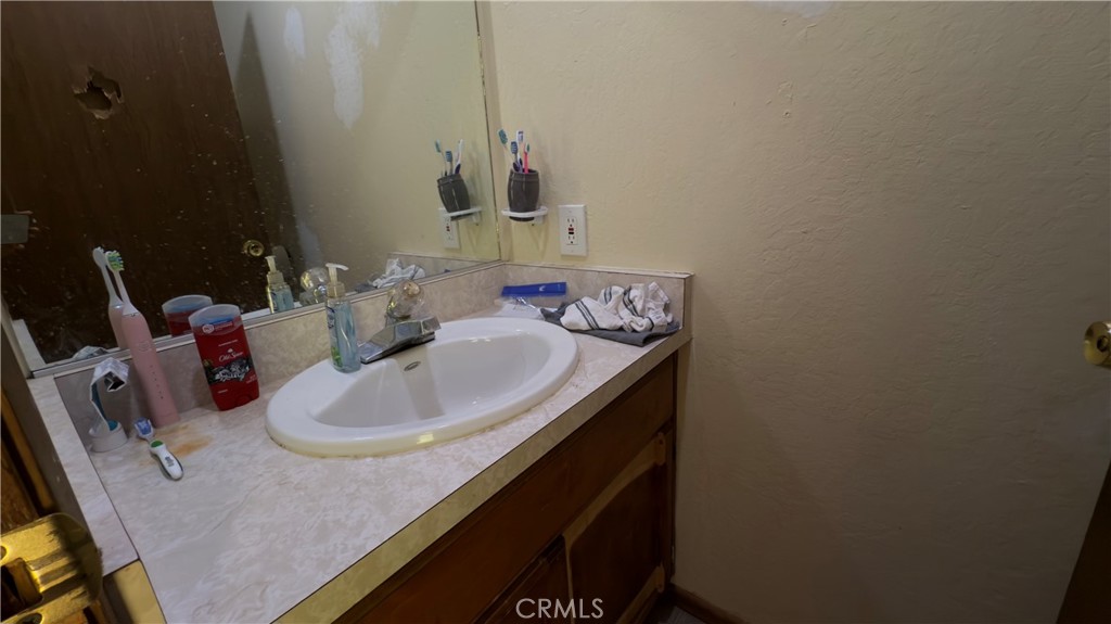 25248 Robinson Road Willits, CA 95490 - Photo 16 of 19 a bathroom with a sink and a mirror