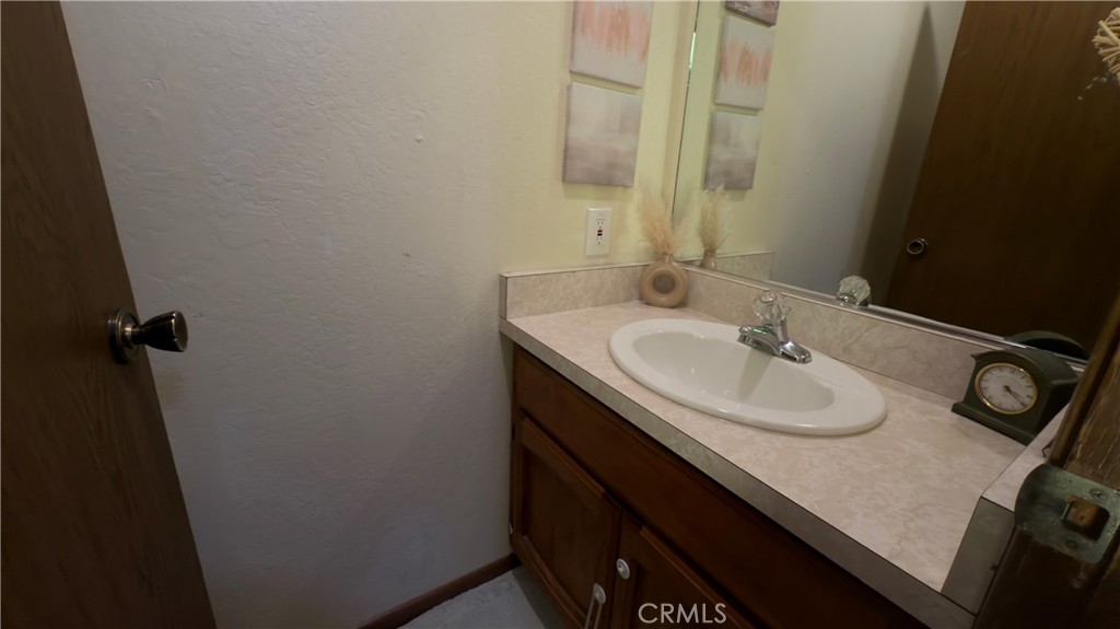 25248 Robinson Road Willits, CA 95490 - Photo 7 of 19 a bathroom with a sink and a mirror