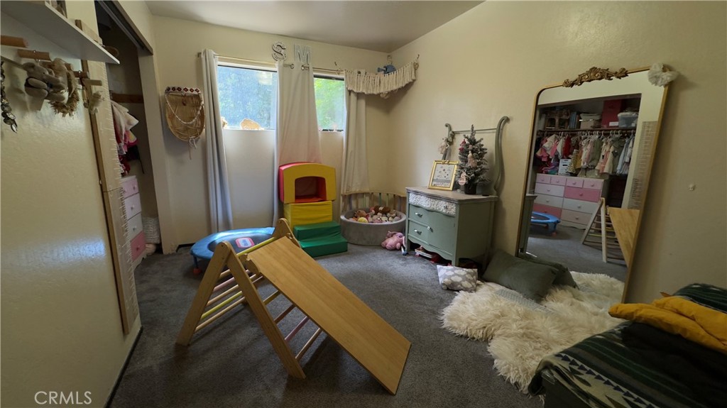 25248 Robinson Road Willits, CA 95490 - Photo 8 of 19 a bed room with a bed and a window