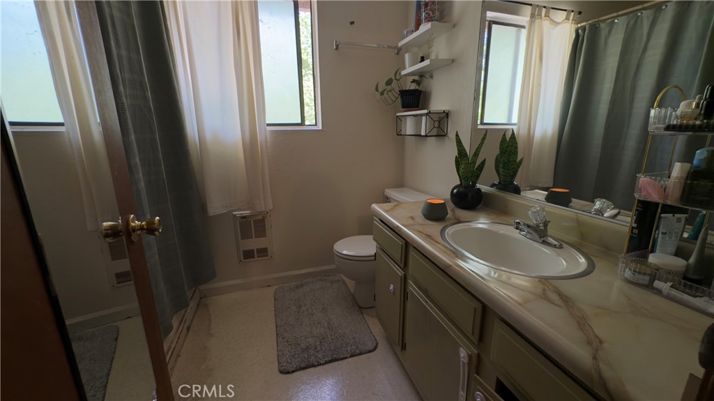 25248 Robinson Road Willits, CA 95490 - Photo 10 of 19 a bathroom with a double vanity sink and mirror