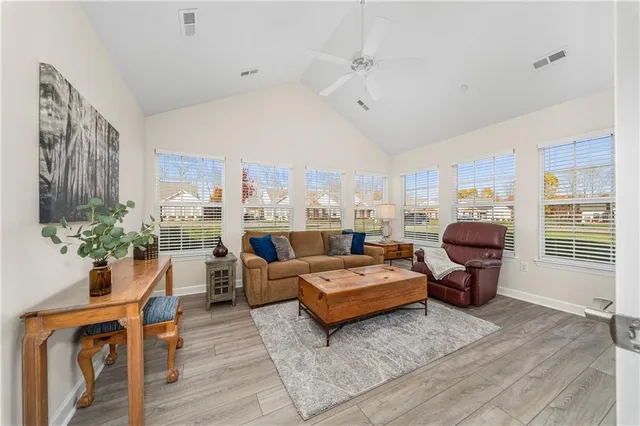 a living room with furniture and a large window