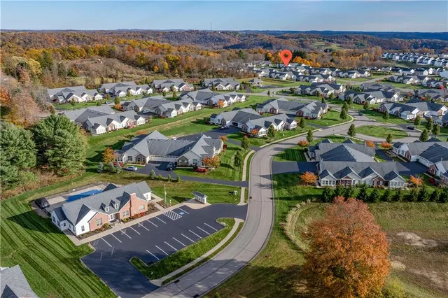 an aerial view of a house with a ocean view