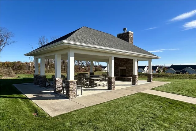 a view of a house with yard porch and sitting area