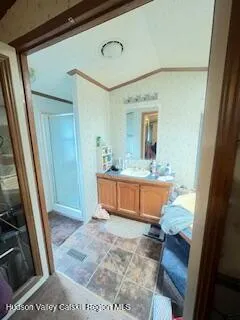 a bathroom with a granite countertop sink and a mirror