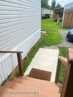 a view of a backyard with sitting area