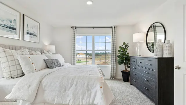 a bedroom with furniture and baby crib